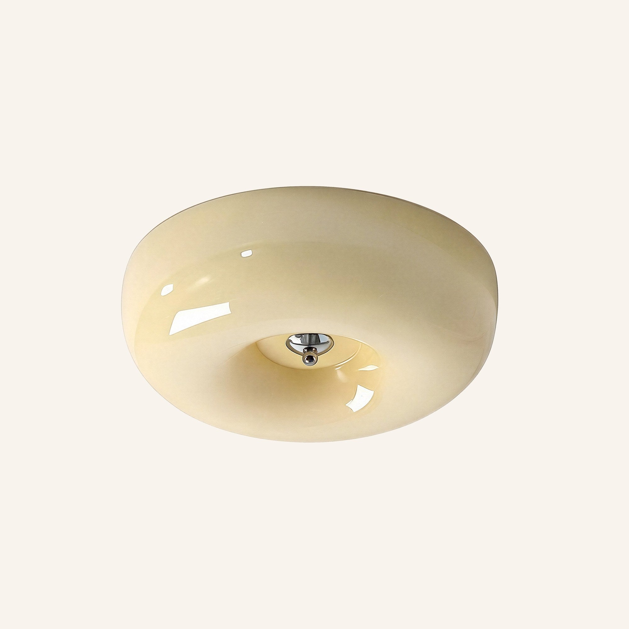 Rounded cream opal glass flush mount with chrome centre cap, photographed on a soft ivory studio backdrop showing its pudding silhouette.