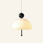 Front view of opal glass pendant lamp in a black colourway, dark ball cap and pull cord contrasting the soft white shade