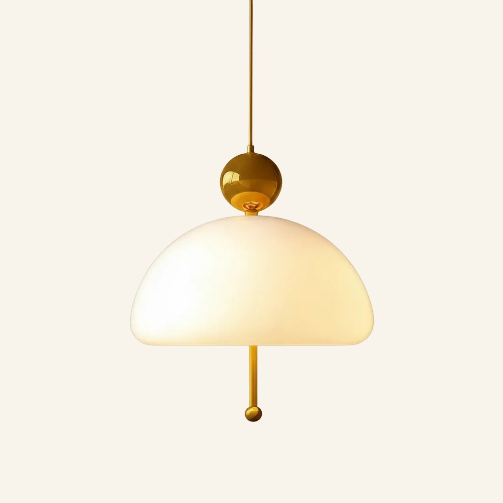Brass colour variant of the dome pendant, polished gold ball cap and slender pull rod paired with a glowing opal glass shade
