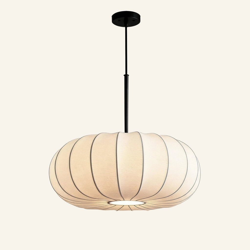 Off-white pleated fabric pendant lamp with rounded pumpkin silhouette, suspended by a slim matte-black ceiling rod against a cream studio backdrop