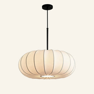 Off-white pleated fabric pendant lamp with rounded pumpkin silhouette, suspended by a slim matte-black ceiling rod against a cream studio backdrop