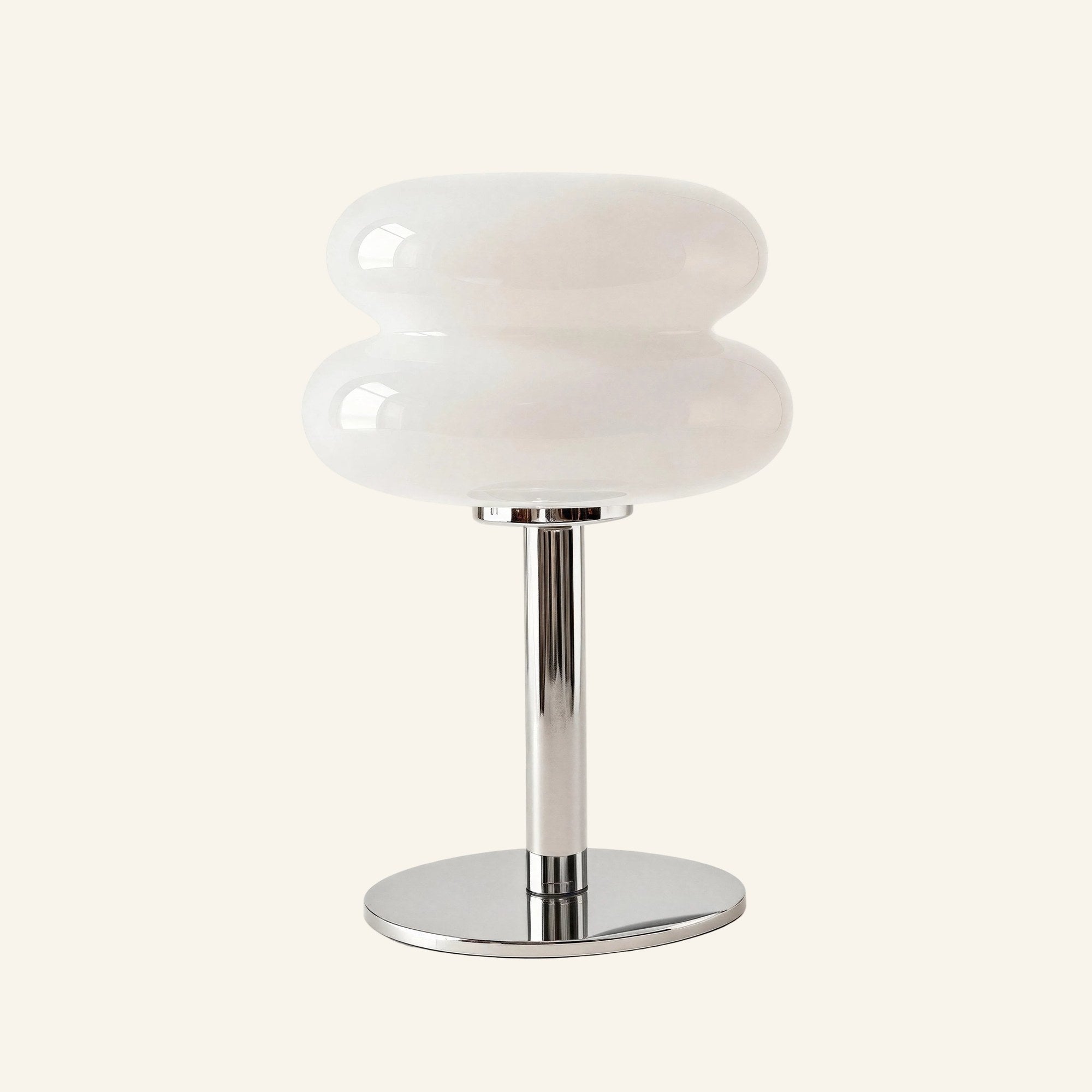Stacked two-tier opal glass shade on polished chrome stem and round base, modern minimalist table lamp on cream studio backdrop