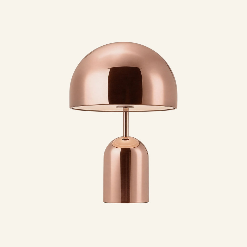 Polished copper finish of the cordless mushroom lamp on neutral backdrop, warm metallic shade casting rosy reflections across the body